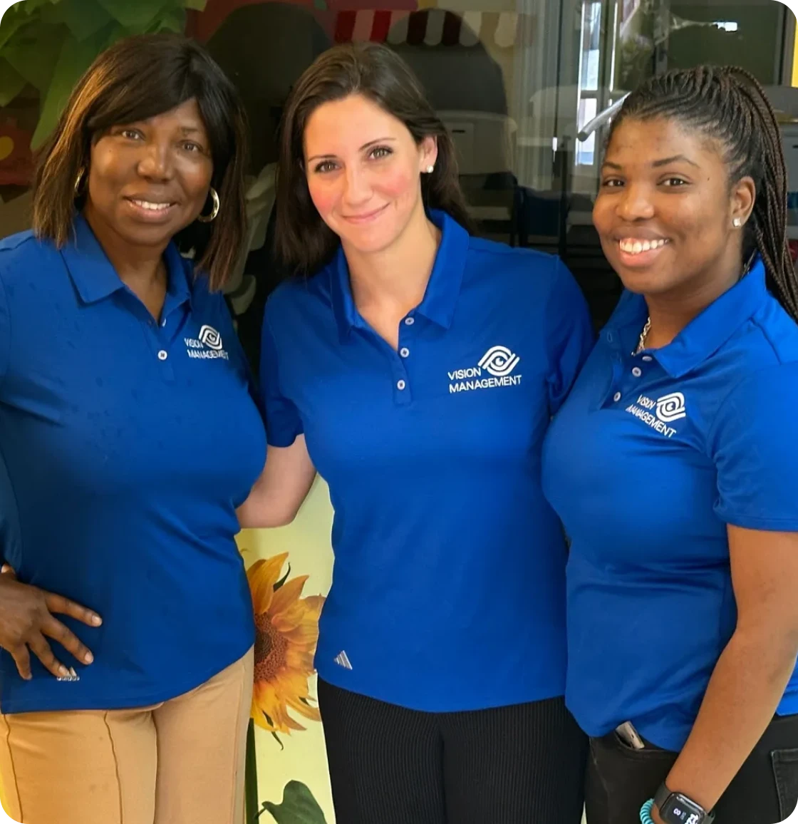 Team members posing together indoors